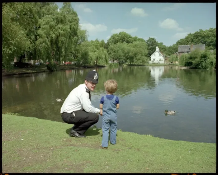 Framed Print : Police Officer and Child Framed Print : Police Officer and Child