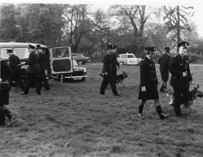 Framed Print : Police officers with dogs, conducting a search, London Framed Print : Police officers with dogs, conducting a search, London
