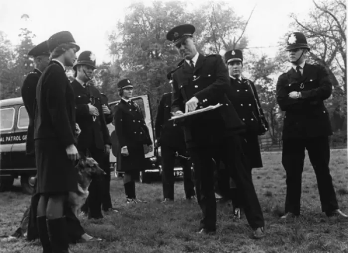 Framed Print : Police officers preparing to conduct a search, London Framed Print : Police officers preparing to conduct a search, London