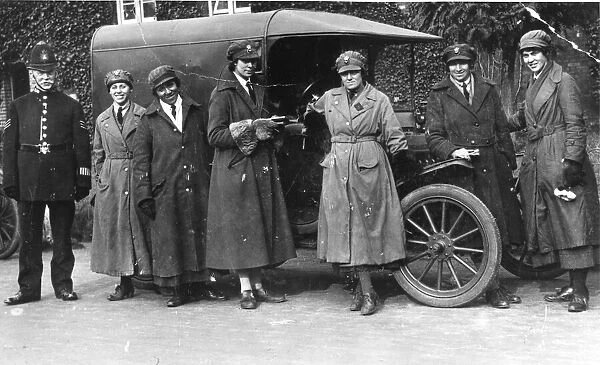 Police sergeant with women in military uniform, WW1