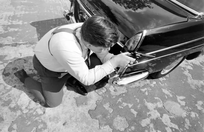 Framed Print : Policeman aiming his gun round the side of a car during training at the Police Gun School Framed Print : Policeman aiming his gun round the side of a car during training at the Police Gun School
