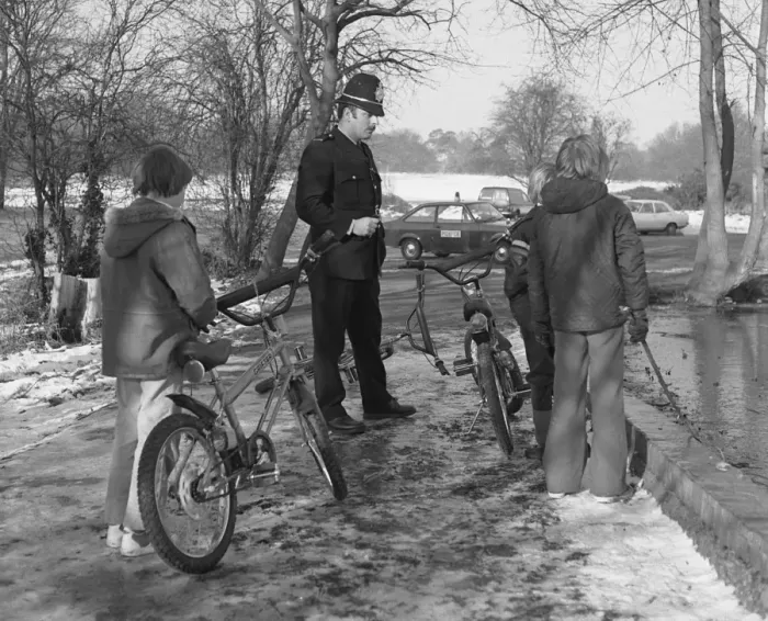Framed Print : Policeman with three boys and their bicycles Framed Print : Policeman with three boys and their bicycles