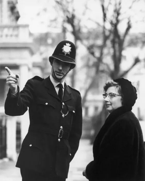 Framed Print : Policeman Directs Lady Framed Print : Policeman Directs Lady