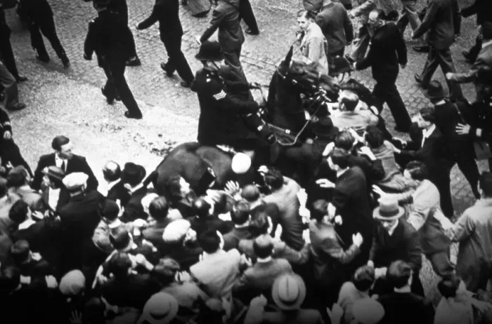Framed Print : Policeman on horseback with an unruly crowd Framed Print : Policeman on horseback with an unruly crowd
