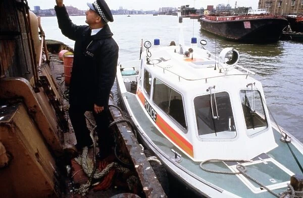 Policeman investigating a river barge