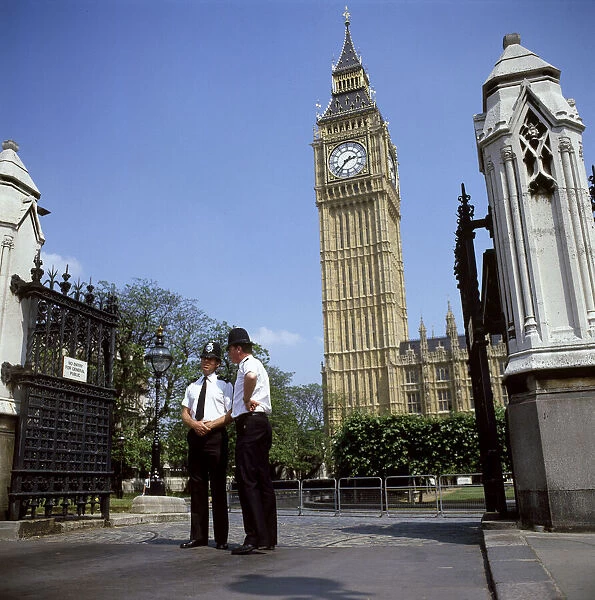Policemen guarding Palace of Westminster with Big Ben