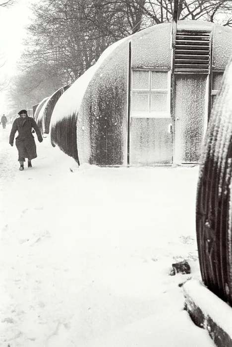 Framed Print : Polish soldier walking outside Nissen Hut covered in snow, Helmsley Resettlement Camp, Yorkshire Date: 1947 - 1948 Framed Print : Polish soldier walking outside Nissen Hut covered in snow, Helmsley Resettlement Camp, Yorkshire Date: 1947 - 1948