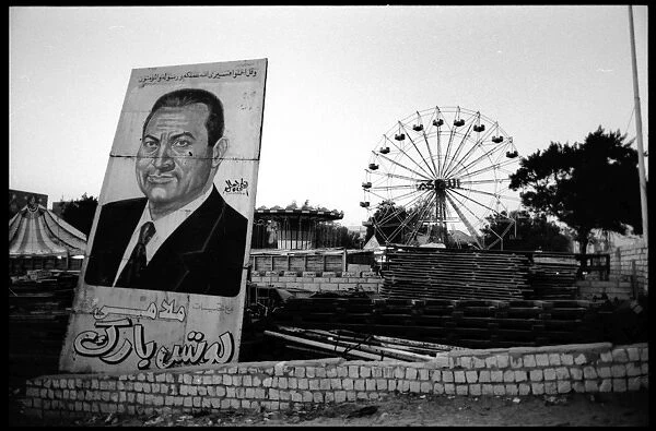 Political poster Mubarak and big wheel, Egypt