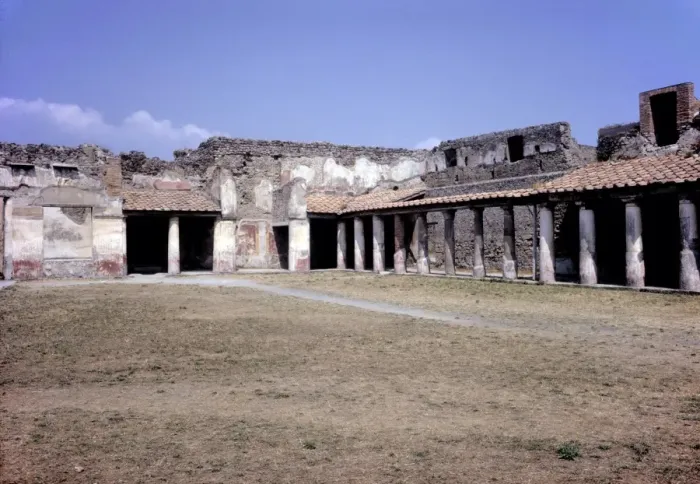 Framed Print : Pompeii. The shaded walkway of a roofed and collonnaded public space surrounding Framed Print : Pompeii. The shaded walkway of a roofed and collonnaded public space surrounding