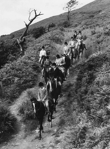 PONY CLUB. A Pony Club of mostly girls and the odd boy, on a days trek in South Wales