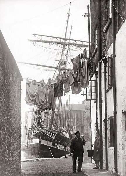 Port scene, with sailor and washing line, UK, 1930 s
