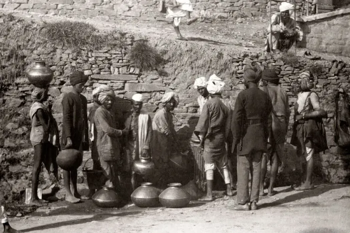 Framed Print : Porter filling water containers, India, c. 1880 s Framed Print : Porter filling water containers, India, c. 1880 s