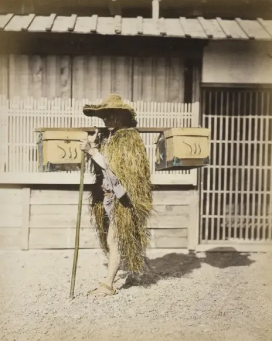 Framed Print : Porter wearing protective outer garments made of straw Framed Print : Porter wearing protective outer garments made of straw