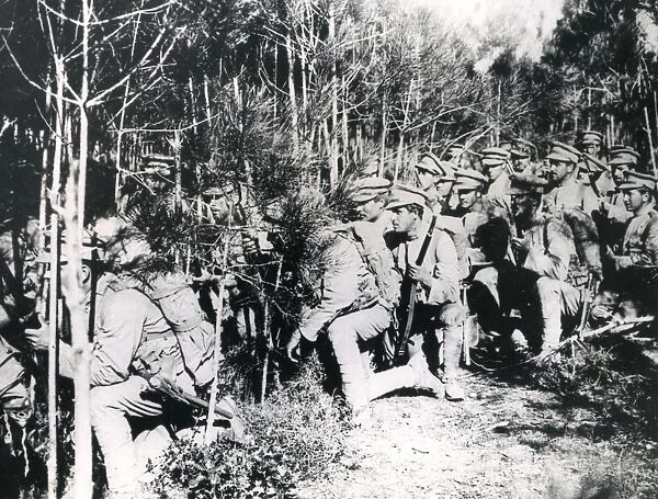 Portuguese soldiers advancing through a wood, WW1