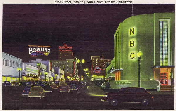 Postcard showing Vine Street at night looking North