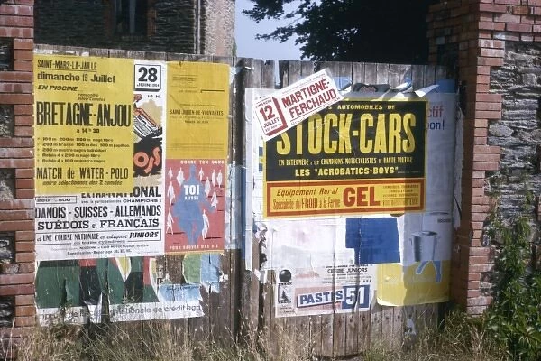 Posters on a fence, western France