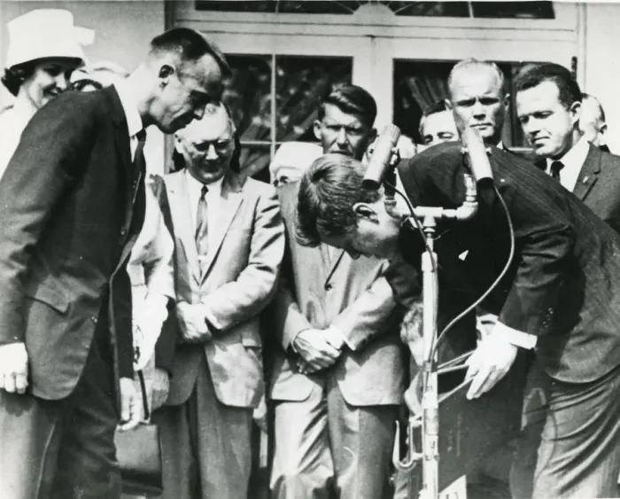 Framed Print : President John F. Kennedy stoops to retrieve the Nation? Framed Print : President John F. Kennedy stoops to retrieve the Nation?