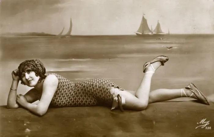 Framed Print : Pretty French girl in fishscale swimsuit reclining Framed Print : Pretty French girl in fishscale swimsuit reclining