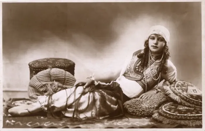 Framed Print : Pretty Hungarian Girl reclining amongst cushions