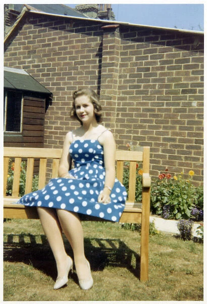 Pretty young lady - blue and white polka dot dress
