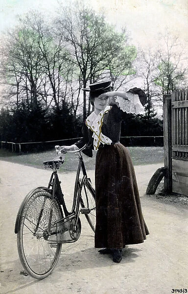 Pretty young woman with her lovely bicycle
