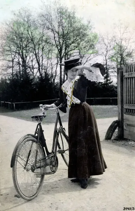 Framed Print : Pretty young woman with her lovely bicycle