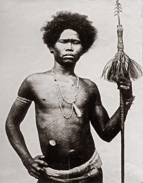 Probably the Philippines - man ritual scarring and spear