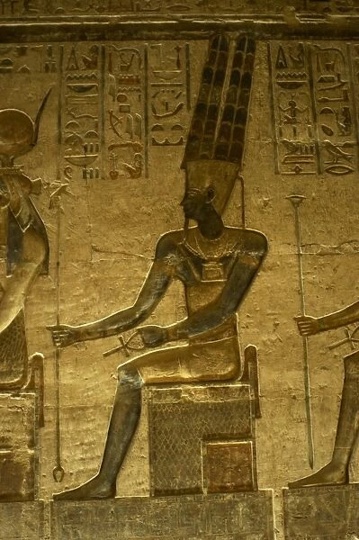 Ptolemaic temple of Hathor and Maat. God Amun. Seated figure