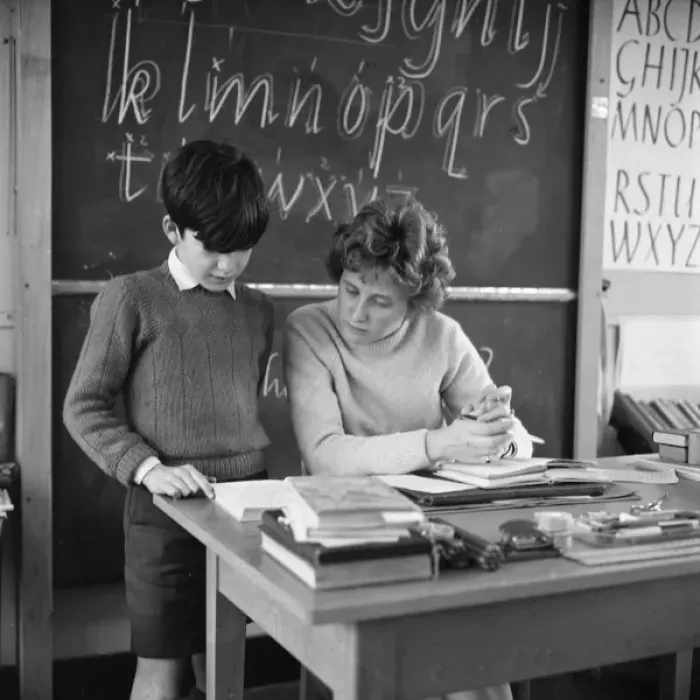 Framed Print : Pupil reading with teacher Framed Print : Pupil reading with teacher