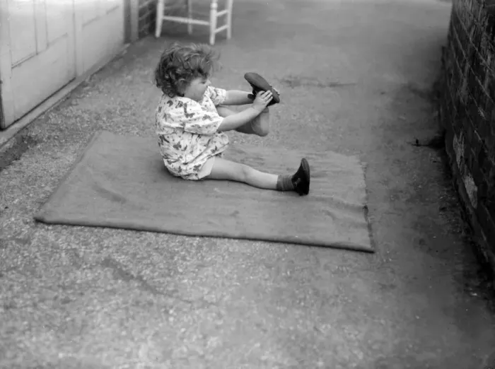 Framed Print : Putting Shoes On Framed Print : Putting Shoes On