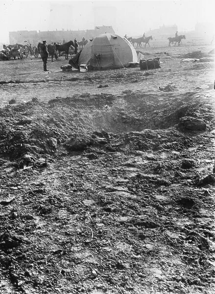 Quartermasters tent with shell hole in foreground, WW1