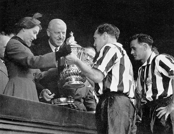 The Queen presents the F.A. Cup to Newcastle