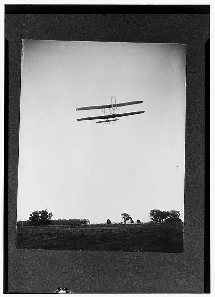 Rear view of flight 46, Orville shown flying at a high altit