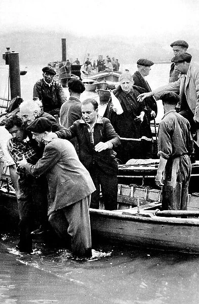 Refugees from Irun come ashore at Hendaye; Spanish Civil War