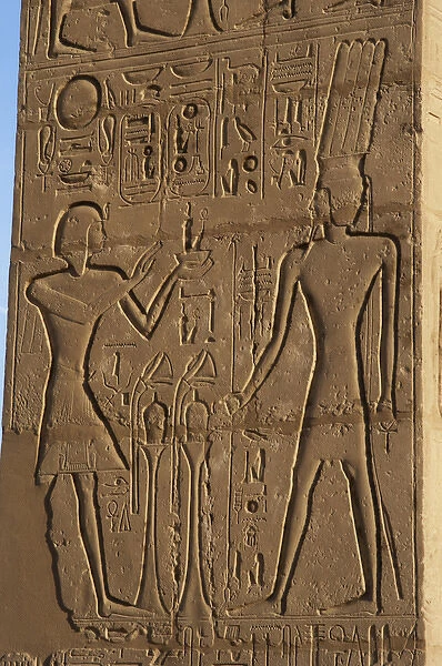 Relief depicting a Pharaoh making offerings to the god Onuri