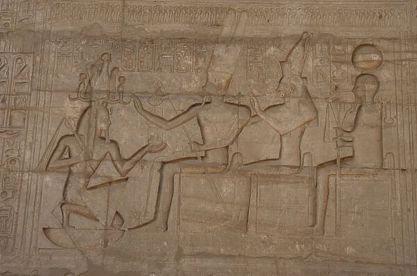 Relief depicting a Pharaoh Ramses II before gods Amun, Munt