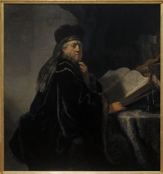 Rembrandt van Rijn (1606-1669). A Scholar in his study or A