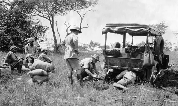 Framed Print : Repairs to a vehicle while on safari, Africa Framed Print : Repairs to a vehicle while on safari, Africa