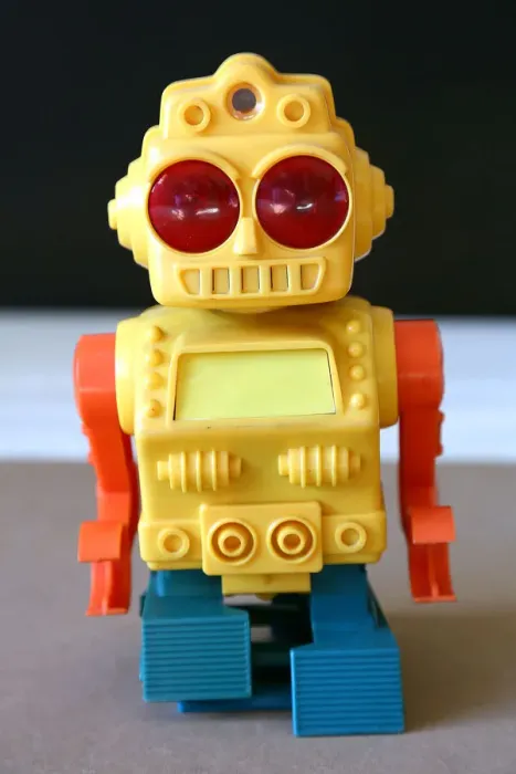 Framed Print : Retro Toy Walking Plastic Robot - Yellow Body (2 / 3) Framed Print : Retro Toy Walking Plastic Robot - Yellow Body (2 / 3)