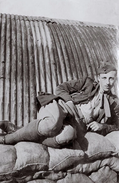 RFC crewman relaxing, Northern France, WW1