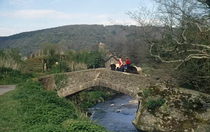 Framed Print : Two riders on Packhorse Bridge, Horner, Somerset Framed Print : Two riders on Packhorse Bridge, Horner, Somerset