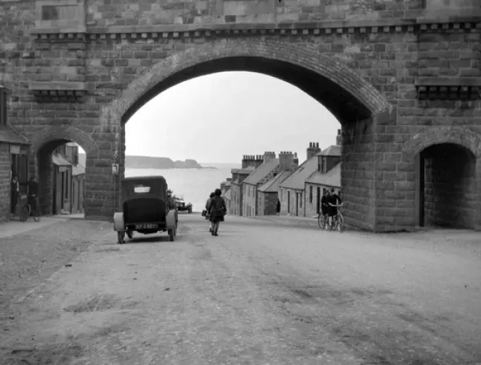 Framed Print : Road with arched bridge leading to the sea Framed Print : Road with arched bridge leading to the sea