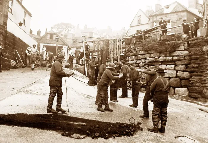 Framed Print : Robin Hoods Bay, fishermen repairing nets Framed Print : Robin Hoods Bay, fishermen repairing nets