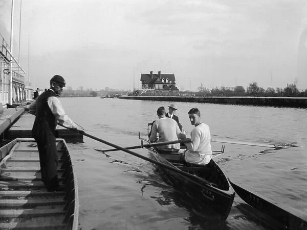 Rowers in a scull on a river