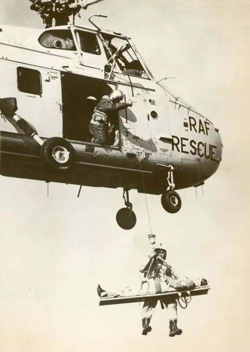 Framed Print : A Royal Air Force Westland Whirlwind winching a stretcher Framed Print : A Royal Air Force Westland Whirlwind winching a stretcher