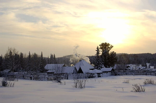 Russian village at midwinter sunset