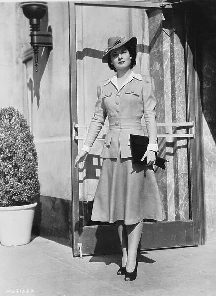 Ruth Hussey modelling a suit ensemble designed by Dolly Tree