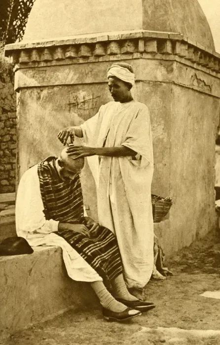 Framed Print : Saharan barber and client, Algeria, North Africa Framed Print : Saharan barber and client, Algeria, North Africa