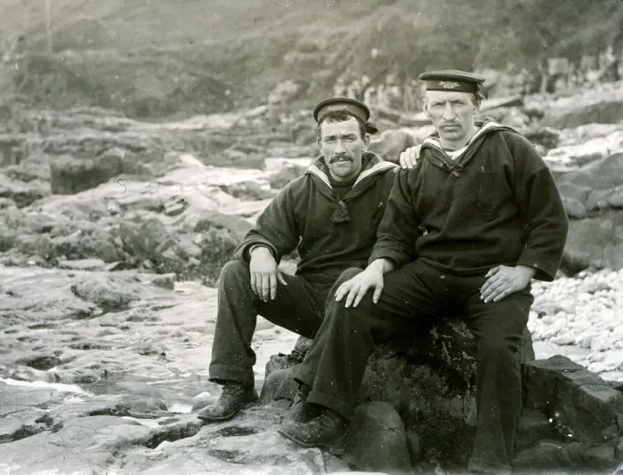 Framed Print : Two sailors sitting on coastal rocks Framed Print : Two sailors sitting on coastal rocks