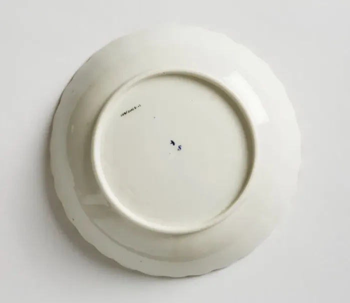 Framed Print : Saucer made from porcelain, transfer-printed in underglaze blue with the Framed Print : Saucer made from porcelain, transfer-printed in underglaze blue with the